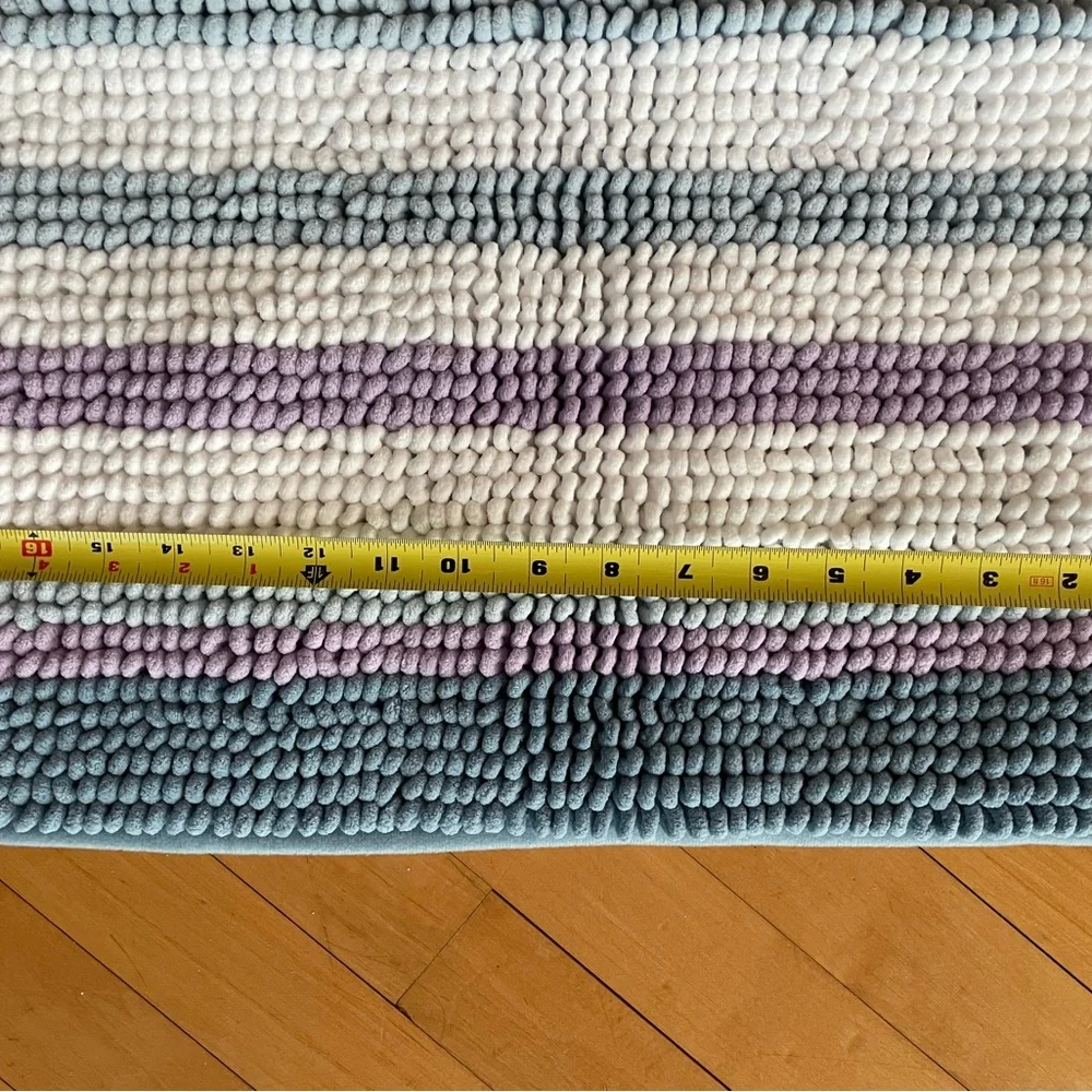 Two - rugs that are purple, white and blue